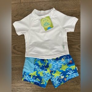 Green Sprouts white rash guard with blue and green turtle trunks. Size 6 months